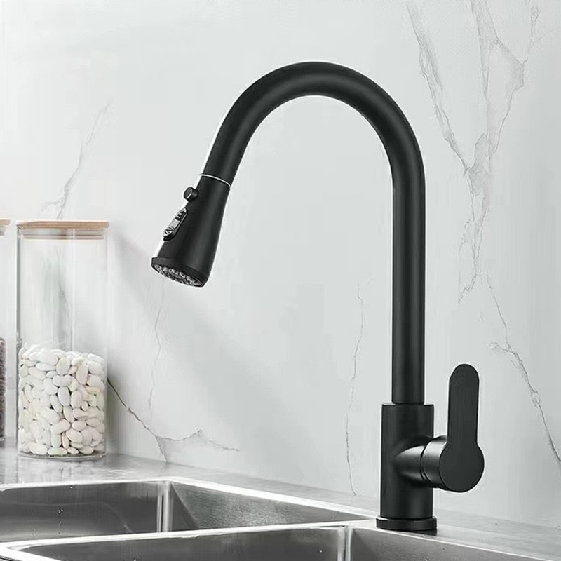 Black pull-down kitchen faucet installed with a stainless steel sink